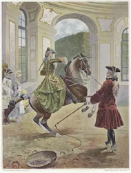 A woman riding a horse which is rearing up before a man holding a whip