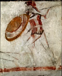 A warrior with a spear and a shield. Lucanian fresco from the 4th century BC, from the Tomb of the Horseman, site of Paestum, Italy. Museo Nazionale Archeologico, Paestum