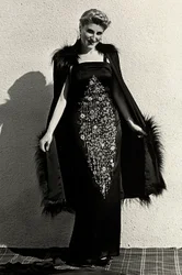 Model in evening dress created by the couture house "Graldi"