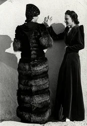 Two models present creations of the Italian couture house 