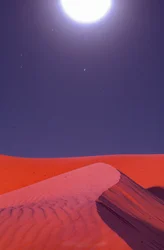Flares over desert sand dunes glow at midnight near Lekhwair oil and natural gas fields
