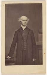 [Unidentified balding man, standing]