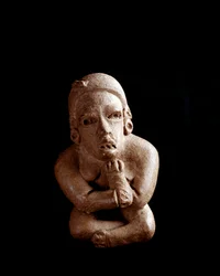 Pre-Columbian Art, Maya Civilization, Pre-Classical Period: Clay Statuette Depicting a Woman Sitting, Arms and Legs Crossed. From San Agustin Acasaguastlan El Progeso, Guatemala. Guatemala City, Museo Nazionale di Archeologia e Etnologia
