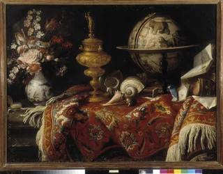 Vase of flowers, astral globe, books and goldwork on a carpet