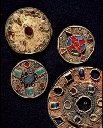 Archaeology of the Middle Ages. Barbarian art of Gaul: fibulae in gold silver works in filigree, polychrome style. France, Merovingian period, 6th-7th century. Strasbourg, Musee d