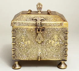 A Mesopotamian silver inlaid brass casket, with dials for a combination lock
