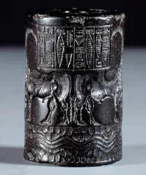 Mesopotamia: cylindrical seal in black marble in the name of the divine Sharkali-Sharri (Shakalisharri), King of Agade, adorned with heroes watering buffaloes back to back. 2300 BC. Paris, Louvre Museum