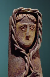 Candle holder with a figure of Jesus