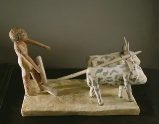 Funerary model of a ploughman leading his plough drawn by two oxen
