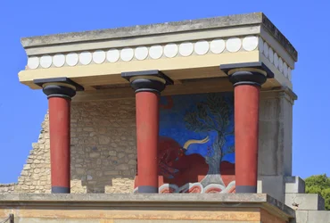 Minoan archaeological site of Knossos. North entrance, North pillar Hall. Bastion reconstructed by Arthur Evans with a copy of a restored relief fresco of a bull. Knossos, Crete