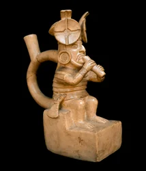 Precolombian art, mochic civilization: anthropomorphic terracotta vase representing a character playing the Quena, flute of the Andes