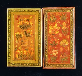 A Pair of Safavid Dynasty Mirror Cases, Painted with Floral Designs, One with a Perched Hoopoe