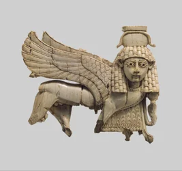 Openwork plaque with a striding sphinx