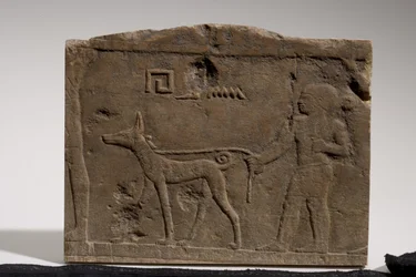 Relief depicting a dwarf and a hunting dog named Ebony, 4th-5th Dynasty, 2573-2311 BC