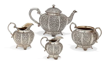 Repousse four-piece tea set, late 19th century