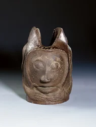 Pot in the form of a grotesque head