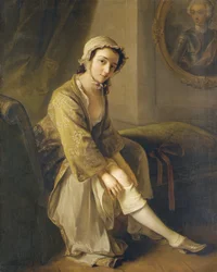 Young woman in a fawn dress