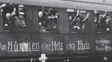 WWI German troops leave for the front in a railway carriage with the message 