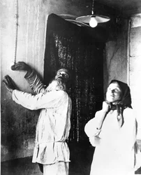 Peasants in the village of Bryansk Gubernia trying out their first electric light bulb