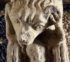 Lion eating a man, base of sarcophagus of D. Afonso Pires, former Bishop of Porto, Lamego, Portugal c.1372