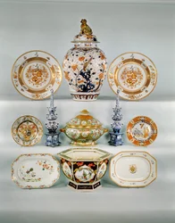 Imari baluster vase; Rose-verte armorial dish, c.1724; Famille rose bombe tureen and cover; Two blue and white tulip vases; Famille Rose armorial plate; Imari plate by Cornelius Prenk; Famille Rose oblong dish; Famille Rose hexagonal jardiniere