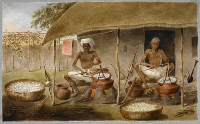 Two men sitting outside a hut drawing out the silk from cocoons, and winding it in spindles by boiling the cocoons in water