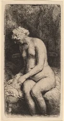 Nude Seated on a Bench with a Pillow