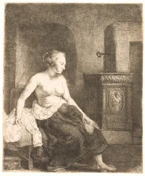 Woman Sitting Half Dressed Beside a Stove
