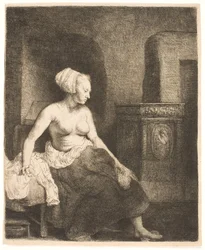 Woman Sitting Half Dressed Beside a Stove