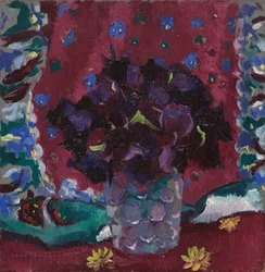 Blue pansies in a glass