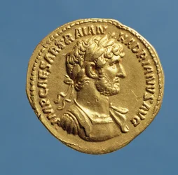 Aureus (obverse) of Hadrian draped, cuirassed, wearing a laurel wreath. Inscription: IMP CAESAR TRAIAN HADIANVS AVG