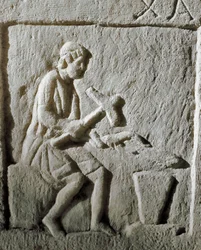 Roman Art: Detail of a Stele Depicting a Blacksmith Striking Metal on an Anvil