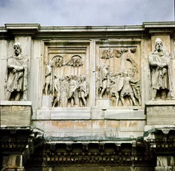 Roman art: low marble relief representing the distribution of subsidies to the people (left) and the surrender of a barbarian leader (right). 312-315 AD. Arch of Constantine, Rome