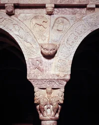 Detail of the lamb of God and symbol of evangelist Luke, carved on the tribune of the Priory