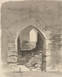 An Arched Entrance into a Ruined Building