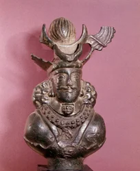 Bust of a Sassanid king in bronze, he wears the royal outfit, with hairstyle featuring a globe supported by lunar crescents. 6th-7th century. E. Borowski Collection
