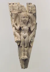 Horse frontlet carved in relief with a female figure flanked by lions