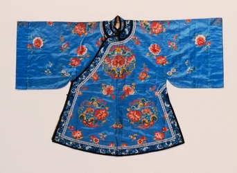 An informal robe of forget-me-not blue satin, embroidered in silks with peony and butterfly roundels scattered with lotus flowers, peaches and other fruit and flowers
