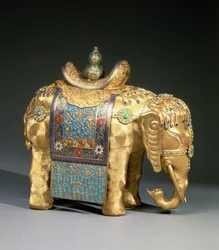 Figure of an elephant, with enamel trappings and coral and turquoise cabochons, saddle cloth decorated with Buddhist emblems, Chien Lung Period, c.1780