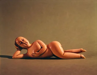 Figurine of woman used by sick patient to show doctor the affected area