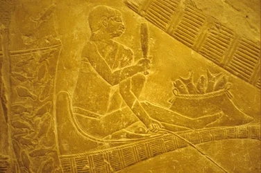 Ancient Egypt, Wall carving/painting, Mastaba/Tomb of Idout, Saqqara, Fishermen sit on boats scaling fish, 6th dynasty