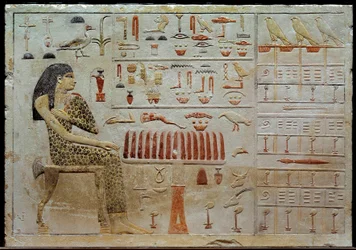 Egyptian antiquity: limestone stele of Nefertiabet represents before a table of offerings. 4th dynasty (around 2620-2500 BC). Paris, Musee du Louvre