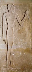 Egyptian antiquity: young woman with lotus flower. Limestone. 5th dynasty, 2300 BC. Paris, Louvre Museum