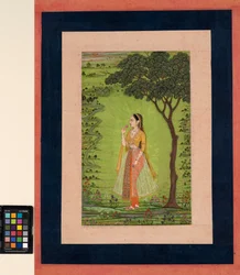 A woman standing by a tree, holding a flower