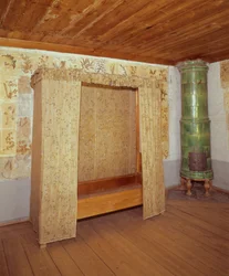 Collapsible bed and ceramic stove in the home of Carl Linnaeus (1707-78)