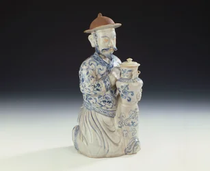 An unrecorded Annamese blue and white ewer formed as a kneeling attendant