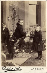 Group of young children and their rocking horse