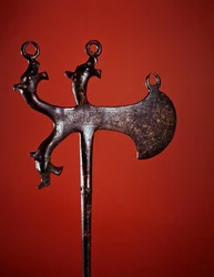 Axe-shaped pin decorated with animal heads