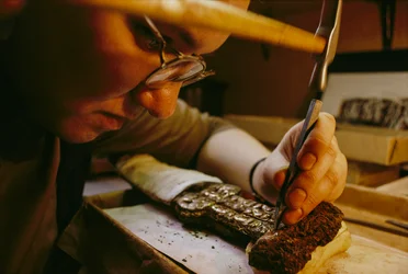 Svetlana Burshneva removes corrosion from a Scythian iron dagger (photo)