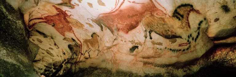 The Red Cows and the Chinese Horses cavort along a wall in the Axial Gallery, Lascaux Cave
